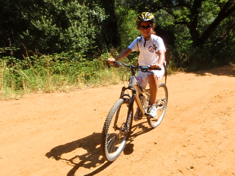 Village Camps International Summer Camp Ard&egrave;che, France 2019-07-26 https://www.villagecamps.com/journals_admin/images/70-8-Alex L looking at home on the bike.jpg
